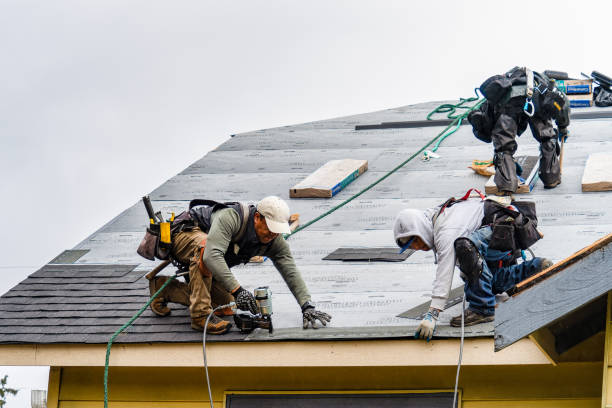 Professional Gutter Installation technician working in Conway, NH